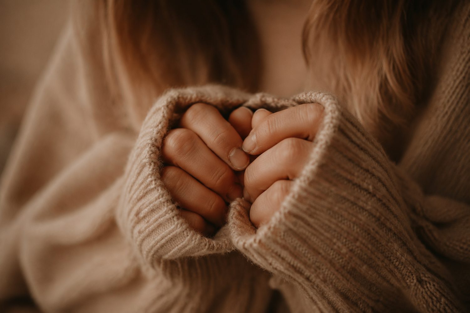 Hiding bitten nails in a sweater