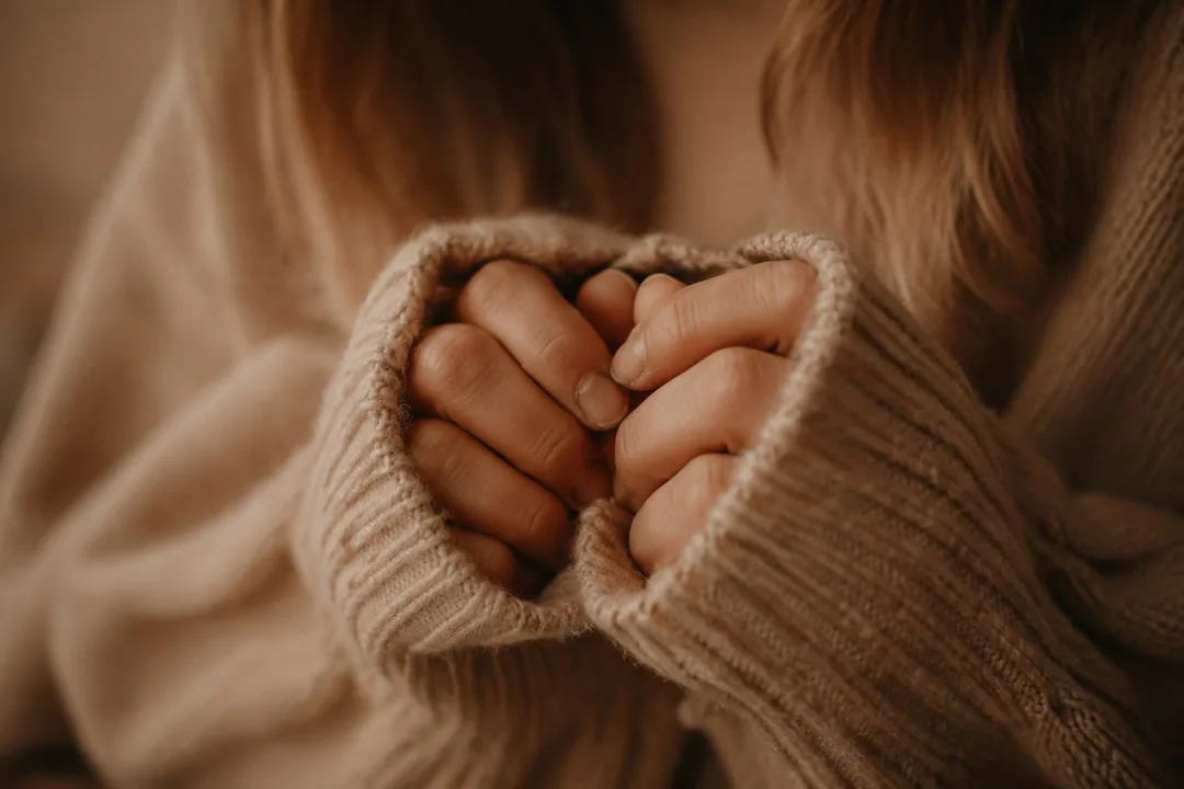 Hiding bitten nails in a sweater